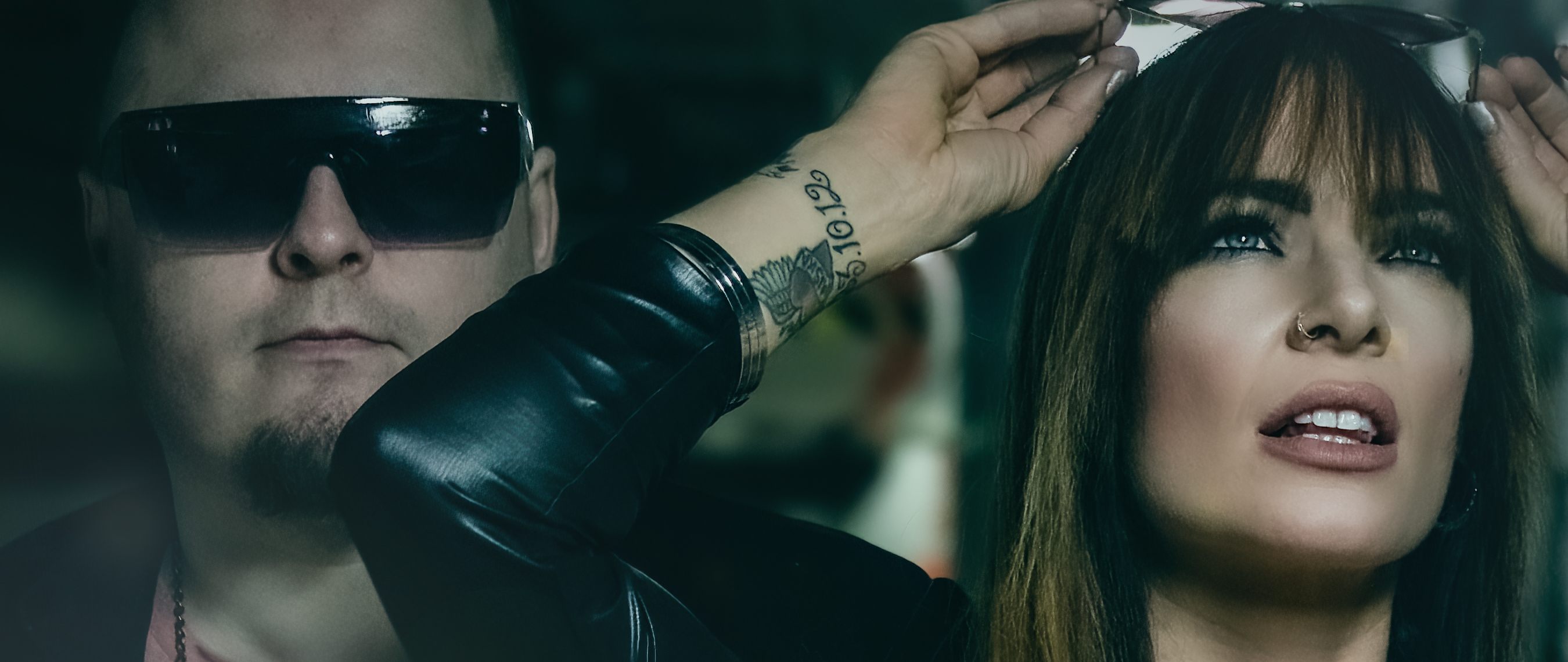 A widescreen version of a promo picture – close-ups of Mike and Tanita.