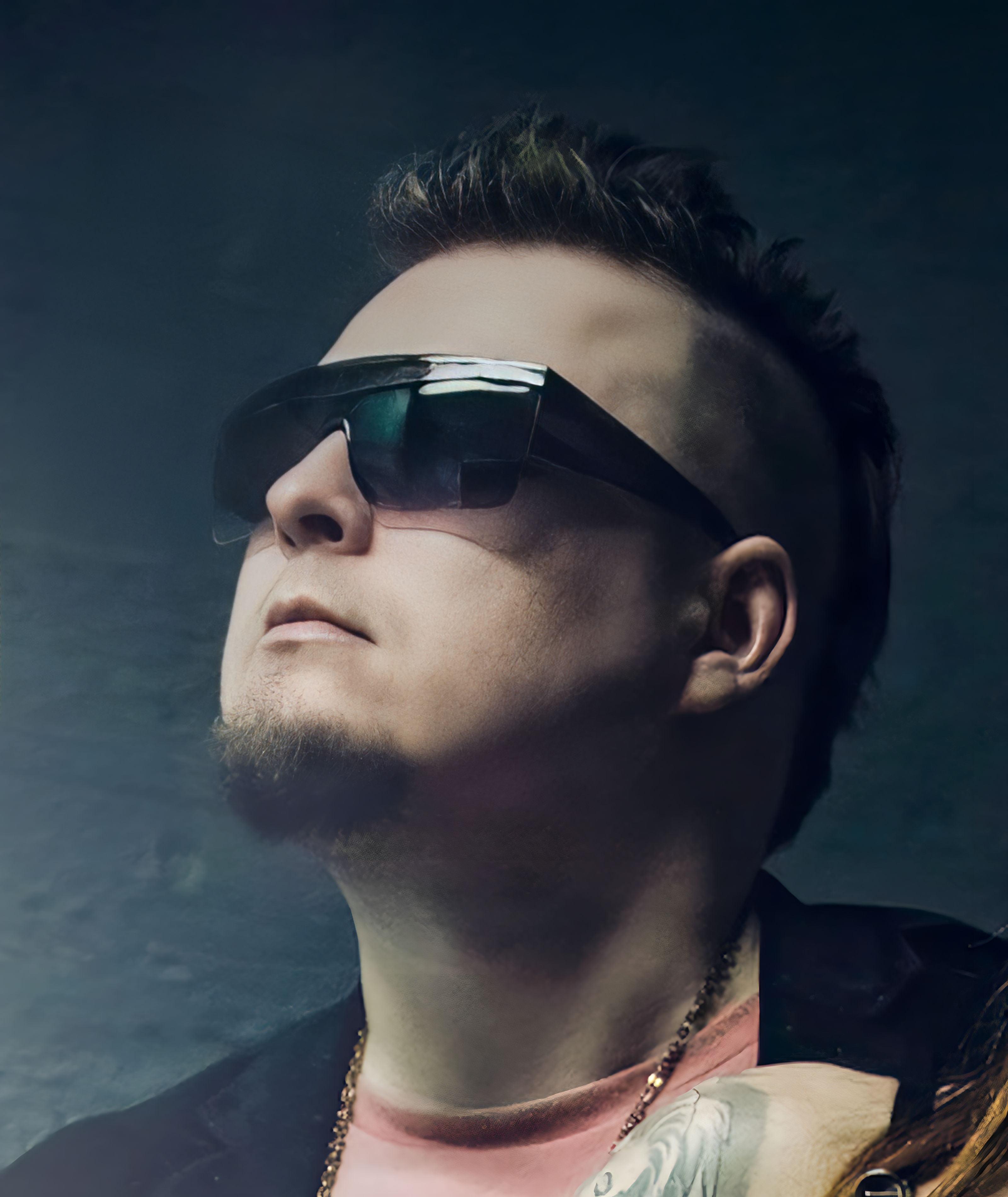 Close-up portrait of Mike. Gold chain and classic Mike Midas signature shades. Photo by Elsa Wellamo.