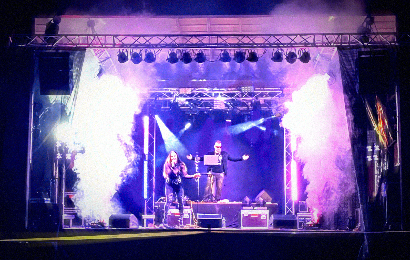 Pyro effects bursting as Atomic Berries kick off their outdoor show.